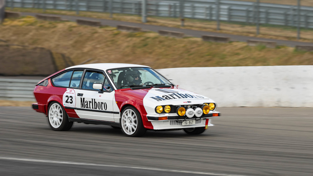 A Marlboro-branded Alfa Romeo Alfetta GTV6 on a race track